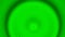 Pulsating green rings spreading like waves on the abstract surface. Design. Grainy texture of moving circles, seamless