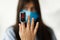 Pulse Oximeter on finger, adult female in face mask measuring blood oxygen level