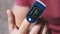 Pulse Oximeter Measures Pulse and Oxygen Saturation on a Male Finger Close-Up