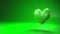 Pulsing green heart shape object on green text space.