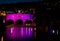 Pulteney Bridge illuminated in pink at night in Bath, Somerset, UK