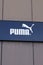 puma logo and text sign front of building shop for fashion store clothing company