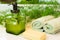 Pump bottle with liquid soap, bar soap, towels and greens on bat