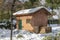 Pump house and water well in OÂ´Donnel park in Alcala de Henares on a sunny day after a snowfall