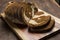 Pumpernickel and rye swirl bread Slices on cutting board