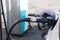 Pumping petrol at gas station into vehicle.hand using a fuel nozzle at a gas station.Petrol Gasoline in Cold weather Safe drive