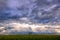 Pumpjack against a dramatic sky