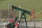 Pumpjack oil fracking crude extraction pump jack machine field, fossil fuel energy industry pumping unit equipment