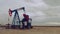 Pumpjack Oil Pump operating on natural gas in the field pumping from the oil well