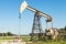 Pumpjack pumps oil in Kuban region, Russia