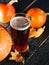 Pumpkin autumn craft red ale beer in a glass on the table