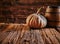 Pumpkin and barrel on old wooden table