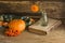 Pumpkin, berries and flowers on wooden background