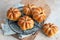 Pumpkin buns bread with spices on brown background. Autumn concept.