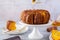 Pumpkin cake with honey on a gray background. Copy space