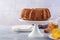 Pumpkin cake with honey on a gray background. Copy space