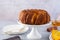 Pumpkin cake with honey on a gray background. Copy space.