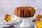 Pumpkin cake with honey on a gray background. Copy space.