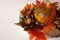 Pumpkin, chestnuts with shells and vivid color autumn leaves on plate, flat lay with copy space