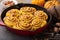 Pumpkin cinnamon rolls in a cast iron skillet