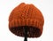 Pumpkin color beanie hat knit isolated