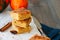 Pumpkin cornmeal bars with spices on a wooden background. Close