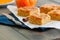 Pumpkin cornmeal bars with spices on a wooden background. Close