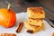 Pumpkin cornmeal bars on a wooden background