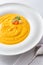 Pumpkin creme soup in white plate