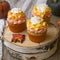 Pumpkin cupcakes with bright orange caps