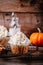 Pumpkin cupcakes decorated with cream cheese frosting