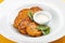 Pumpkin cutlets with white sauce. Vegetarian dish. Isolated image on a white background