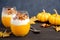 Pumpkin dessert with yogurt and homemade granola on dark wooden table
