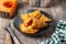 Pumpkin empanadillas on wooden table