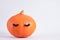 pumpkin with false eyelashes on gray background