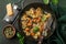 Pumpkin farfalle pasta with pumpkin seeds and cheese in bowl