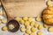 Pumpkin gnocchi with pumpkin, wooden spoon,almonds , flour on wooden cutting board, on wooden rustic background top view