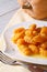 Pumpkin gnocchi with sauce and spices on the plate, vertical