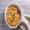 Pumpkin Gratin with leek, thyme and cheese on a gray background