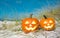 Pumpkin Halloween Jack-o-lantern party on the beach. Trick or treat Happy Halloween. Autumn season. On background ocean. Autumn in