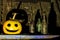 Pumpkin head and old bottles with scary shadows