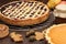 Pumpkin homemade pie at wooden background arranged with food ing