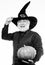 Pumpkin lamp. mature man magician in witch hat. evil wizard hold orange pumpkin. Stargazer in holiday costume