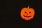 Pumpkin layout for Halloween on a black background with orange sequins