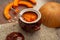 Pumpkin milk soup in a pot, close-up