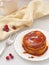 Pumpkin pancakes with caramel sauce and cranberries