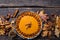 Pumpkin Pie with pecan nut and cinnamon on rustic background, top view, copy space. Homemade autumn pastry for Thanksgiving