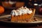 Pumpkin pie slice with a dollop of whipped cream