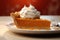 Pumpkin pie slice with a dollop of whipped cream