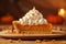 Pumpkin pie slice with a dollop of whipped cream